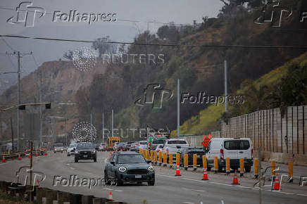 Cars drive along Pacific Coast Highway, in Los Angeles