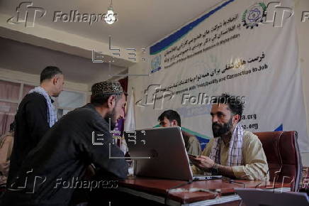 Afghans register for a labor program to work in Qatar