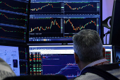 Traders work on the floor of the NYSE in New York
