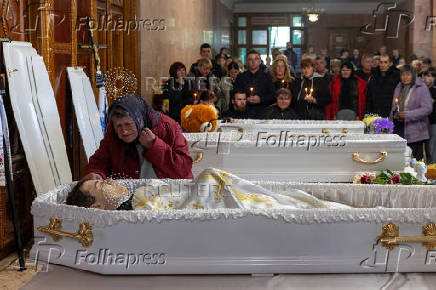 Funeral of the Tamara, Stanislav and Roman Martyniuk who were killed in a Russian missile strike in Korostyshiv