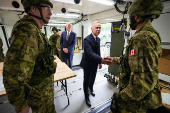 Canada?s PM Carney greets troops inside a truck at Fort York Armoury in Toronto