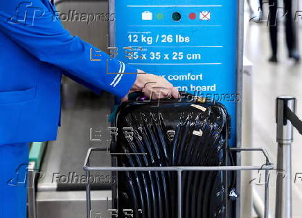 Travelers with their luggage at Schiphol Airport near Amsterdam