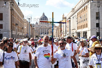 LGBTQ Pilgrims walk toward St. Peter's Basilica