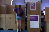 A young woman votes at a pre-polling centre in Sydney