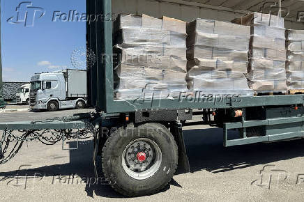 Trucks carrying aid are seen at the Kerem Shalom crossing between Israel and Gaza, on its Israeli side