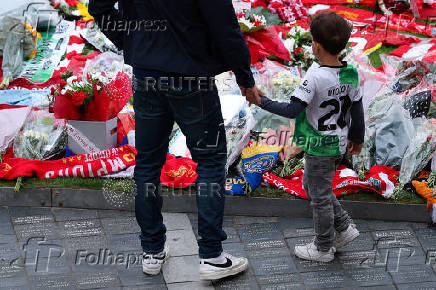 Fans pay their respects to late soccer player Diogo Jota, at Anfield Stadium in Liverpool