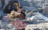 Aftermath of an Israeli strike on an UNRWA school sheltering displaced people, in the Bureij camp in the central Gaza Strip