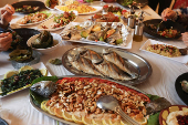 Food is placed on a table at Zainab Khalifeh's restaurant, a Lebanese who turned a part of her home into a restaurant and called it 'Zainab's table' in the town of Sarafand,