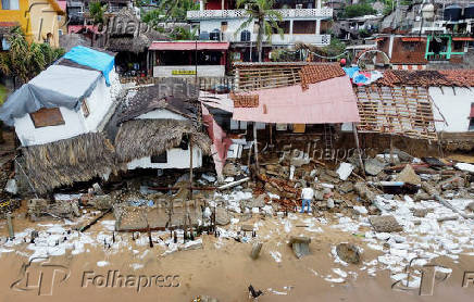 Erick weakens to tropical storm over Mexico, leaves trail of damage