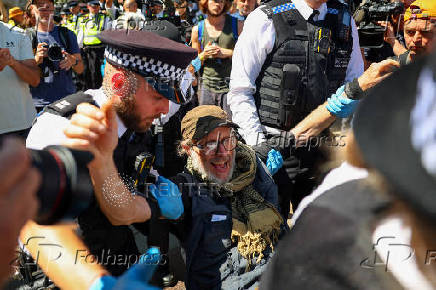 People gather in Parliament Square calling for the de-proscription of the Palestine Action group, in London