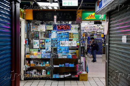 A customer checks out an electronics hardware store in Taipei