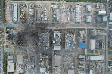 Rescuers work at the explosion site at a chemical plant in Gaomi