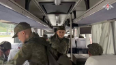 Russian younger POWs board bus in Belarus after release from Ukraine