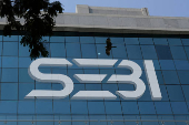 FILE PHOTO: The logo of Securities and Exchange Board of India (SEBI) is seen on its headquarters in Mumbai