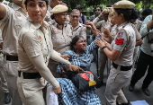 Protests in Delhi after student set herself on fire at college in Odisha