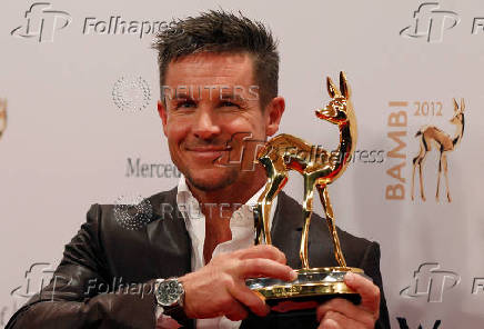 FILE PHOTO: Austrian space jumper Baumgartner poses with his trophy after the 64th Bambi media awards ceremony in Duesseldorf