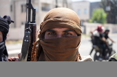 Fighters from Bedouin tribes deploy in the Druze-majority town of Mazra'a