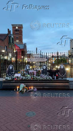 Flowers are kept on the Black Sabbath bench, as a tribute to Black Sabbath's late Ozzy Osbourne, in Birmingham