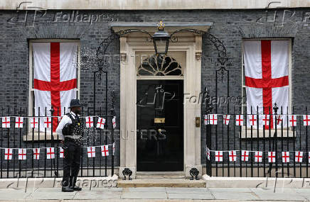 England flags remain on display at 10 Downing Street after the England victory parade took place outside Buckingham Palace, in London