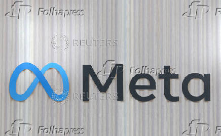 FILE PHOTO: The logo of Meta is seen at the entrance of the company's temporary stand ahead of WEF in Davos