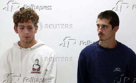 Belgian nationals Lornoy David and Seppe Lodewijckx look on during the hearing of their case after they pleaded guilty to illegal possession and trafficking of garden ants, in Nairobi