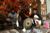 Blacksmiths sharpen blades for flagellation ahead of Ashura in Peshawar