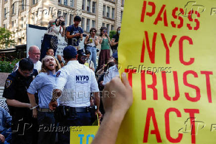 People protest against ICE outside U.S. immigration court in New York