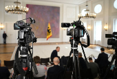 Members of the media wait at Bellevue Palace, as Merz of the CDU fails to be elected chancellor by the German parliament after first voting round, in Berlin