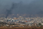 Smoke rises from Gaza, as seen from the Israel