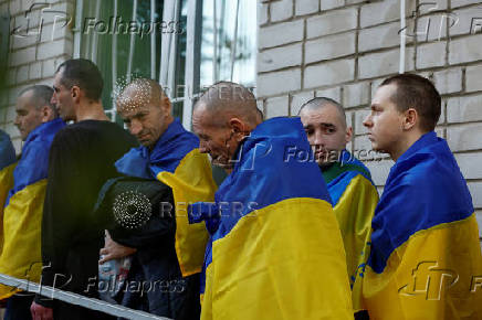Ukrainian prisoners of war are seen after they return after a swap in an undisclosed location in Ukraine