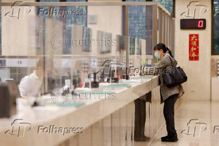 FILE PHOTO: A woman can be seen inside Taiwan's central bank in Taipei