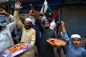 Markazi Muslim League celebrate after Pakistan shoots down Indian fighter jets