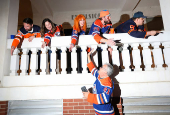 Edmonton Oilers fans react in a fan zone during the first game of the Stanley Cup Finals against the Florida Panthers, in Edmonton