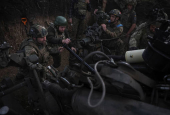 Servicemen fire a howitzer towards Russian troops at position on front line in Donetsk region