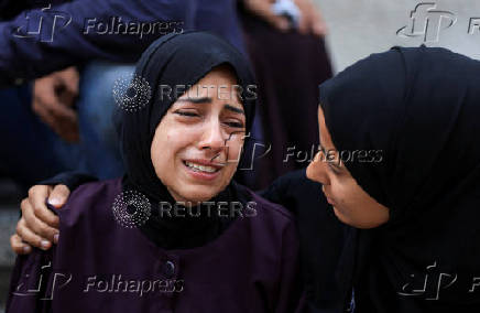 Funeral of Palestinians killed on Sunday by Israeli fire while seeking aid in northern Gaza, according to Gaza's health ministry, at Al-Shifa Hospital