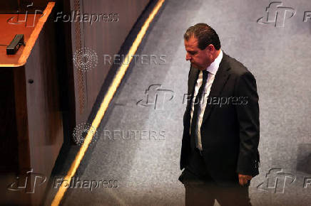 Israeli Knesset member Ayman Odeh walks at the plenum in the Knesset, Israel's parliament, ahead of a vote over his possible expulsion from parliament, in Jerusalem