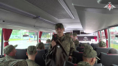 Russian soldiers board a bus in Belarus after release from Ukraine on the third day of POW exchange