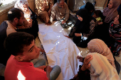 Funeral of Palestinians killed in Israeli strikes, at Nasser hospital, in Khan Younis, southern Gaza Strip