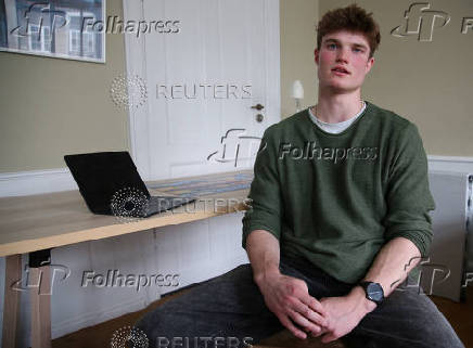 Harvard student Alfred Williamson, who comes from Wales, talks during an interview in Copenhagen