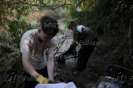 Chilean volunteers combat plastic waste in the Mapocho river, in Santiago