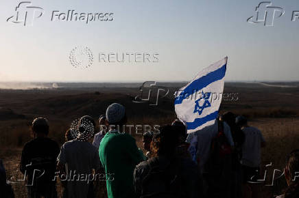 Israeli right wing activists take part in a rally organized by settlers groups to promote Israel's resettling in Gaza
