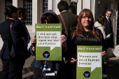 People await a ruling on an appeal by For Women Scotland outside the Supreme Court in London