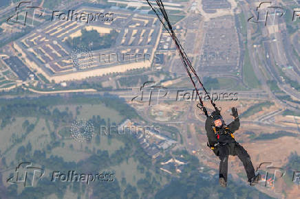 U.S. Army Golden Knights parachute team perform during the Twilight Tattoo ceremony