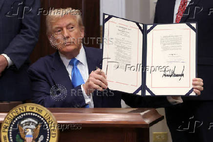 U.S. President Trump signs the VA Home Loan Program Reform Act at the White House in Washington, D.C.