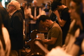 Worshippers participate in Stations of the Cross at St Mary’s Catholic Cathedral in Sydney