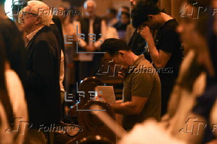 Worshippers participate in Stations of the Cross at St Mary’s Catholic Cathedral in Sydney