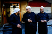 Fahed Abu Haidar, resident of Jaramana, speaks to Mwaffaq Abu Shash, a Druze cleric, following deadly clashes between Sunni fighters against armed Druze residents, Jaramana,
