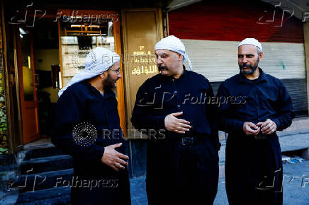 Fahed Abu Haidar, resident of Jaramana, speaks to Mwaffaq Abu Shash, a Druze cleric, following deadly clashes between Sunni fighters against armed Druze residents, Jaramana,