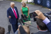 President Trump responds to questions from the media as he departs for Pennsylvania
