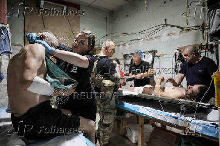 Ukrainian Armed Forces combat medics treat injured servicemen near Chasiv Yar